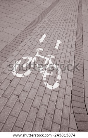 Bicycle Lane Sign in Urban Setting in Black and White Sepia Tone