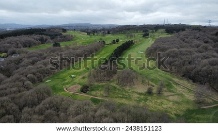 An Ariel picture of a golf course from above taken in high resolution