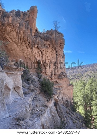 Bandelier National Monument preserves Ancestral Puebloans home in New Mexico. View of Frijoles Canyon from Alcove House.  Royalty-Free Stock Photo #2438153949