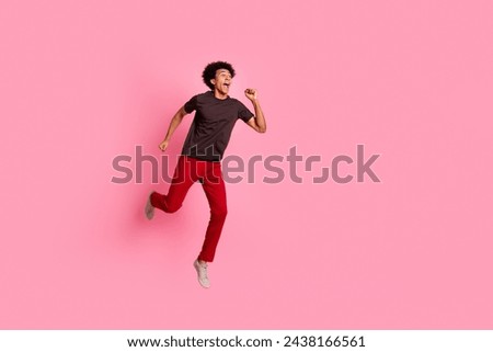 Full length body photo of funny american guy running marathon for humanitarian foundation collect money isolated on pink color background