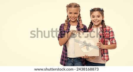 children girls with boxes. happy birthday. birthday present box. children girls sharing present. present to friend. present box from shopping. Girls holding a box filled with treasures. copy space