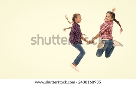 children have fun together. bond of sisterhood and friendship. girls friends having fun and jumping. friendship of two children. happy girls sisterhood. enduring power of sisterhood. copy space Royalty-Free Stock Photo #2438168935