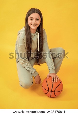 sport school activity. teen girl with basketball ball on court. school basketball player. sport motivation. sport and hobby. girl on phisical training lesson. back to school