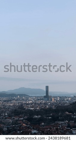 view of the city in the afternoon from the top of the hill