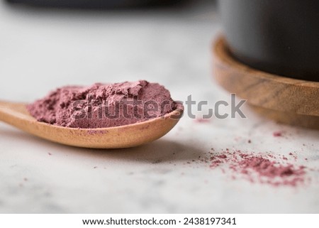 Close up view of organic freeze dried black currant powder