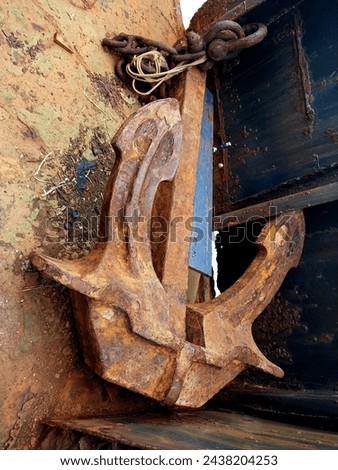 A barge anchor is lying on the deck