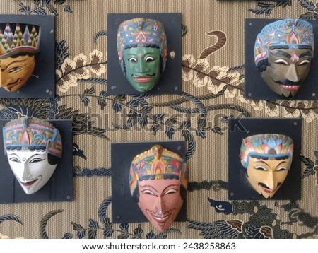 photo of Malang mask with batik background, Batu City, Indonesia, June 10, 2023