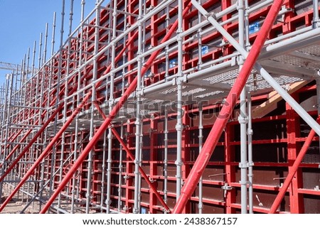 Vertical panel formwork, push-pull jacks and scaffoldings of reinforced concrete walls under construction. Structures for cast in place reinforced concrete Royalty-Free Stock Photo #2438367157
