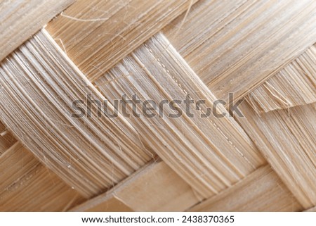 Texture of a chipped woven bamboo. This is the second variation to pictures taken of this object.