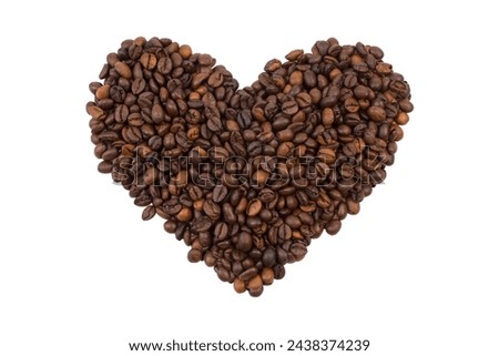 A bunch of coffee beans in the shape of a heart isolated on a white background. View from above