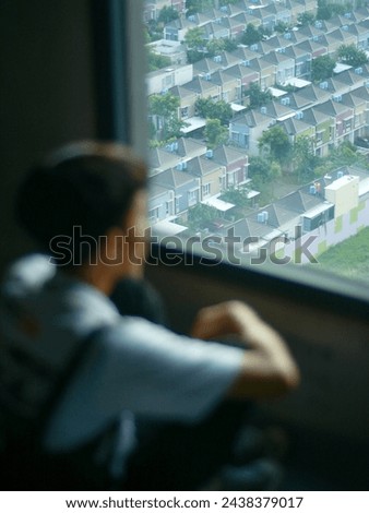 A person staring to the distance of city