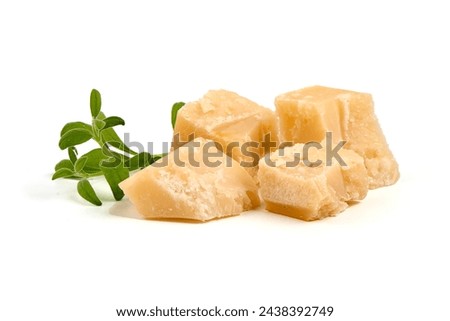 Parmesan cheese chunks, hard cheese, isolated on white background Royalty-Free Stock Photo #2438392749