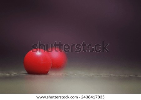 The red ball with another one is blur. Great for background.