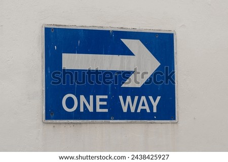 A one way street sign.