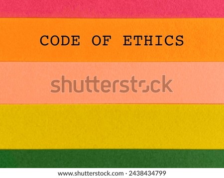 Business concept - Code of ethics on multicolored paper background. Stock photo.
