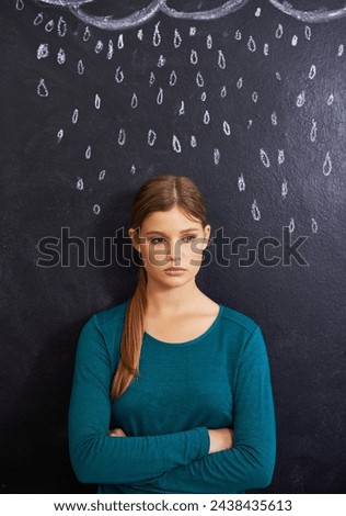 Rain, sad and woman with cloud on chalkboard for depression, unhappy and upset mood. Storm, winter weather and person with crossed arms for attitude, emotion and worry expression on dark background