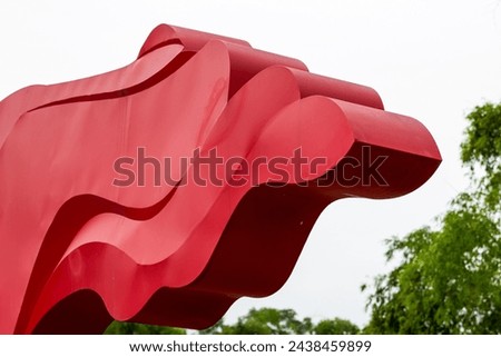 Close-up of an elegant red flag sculpture