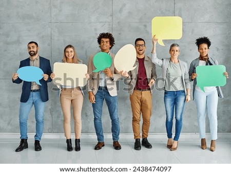 Portrait of a group of young business people in office. Speech bubble, team and comment by business people holding sign, news and voice icon feeling excited on social media. Group, opinion and poll 