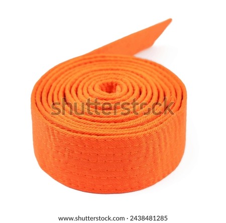 Orange karate belt isolated on white. Martial arts uniform Royalty-Free Stock Photo #2438481285