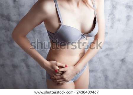young beautiful woman in underclothes in the studio Royalty-Free Stock Photo #2438489467