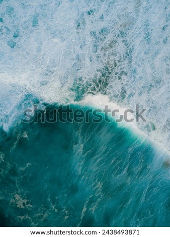 "Dancing Waves" are rhythmic water motions shaped by wind, gravity, and surface tension, seen in oceans and fields, showcasing nature's fluid beauty and harmony in mesmerizing patterns. Royalty-Free Stock Photo #2438493871