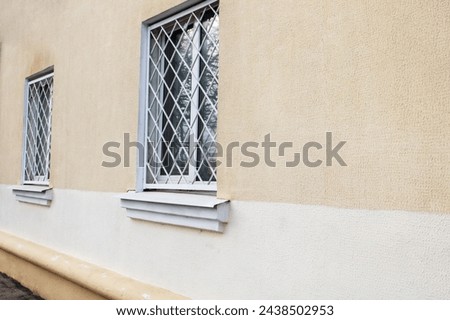 Grid on the window of moaning home close up Royalty-Free Stock Photo #2438502953