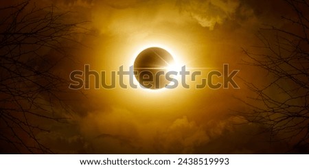 Solar eclipse. Sun behind the clouds and moon. Amazing scientific natural phenomenon. Royalty-Free Stock Photo #2438519993