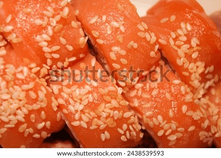 Stock photo of Philadelphia sushi roll. High quality image of sushi with salmon and white sesame. Fast food with place for text.