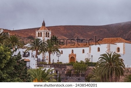 Church of Santa Maria de Betancuria, Canarian style, surrounded by an oasis of trees and palm groves on the Canary Island of Fuerteventura.
