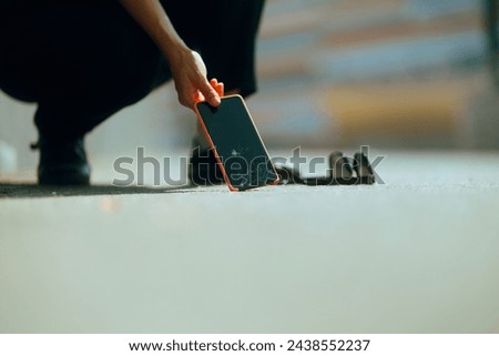 

Woman Dropping her Smartphone on the Pavement Breaking it. Unlucky girl smashing her mobile screen on the concrete floor
 Royalty-Free Stock Photo #2438552237
