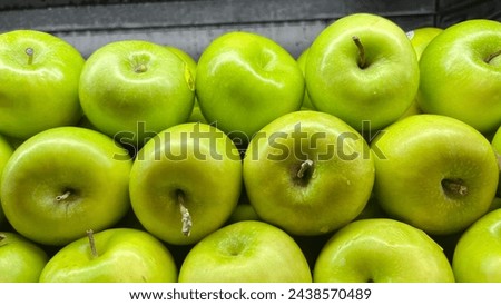 Plenty of green apples in grocery store or supermarket in some markets in Indonesia