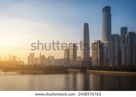Golden Sunrise Over Modern City Riverfront