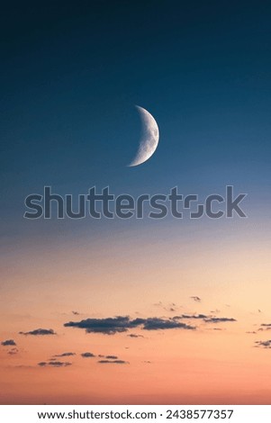 The brightness of the sky with the moon varies based on factors like moon phase, atmospheric conditions, and light pollution, ranging from brightly illuminated to dimly lit. Royalty-Free Stock Photo #2438577357
