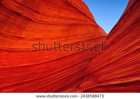 Early morning light on The Wave sandstone formation, Coyote Buttes North, Vermilion Cliffs National Monument, Arizona, USA. Royalty-Free Stock Photo #2438588473