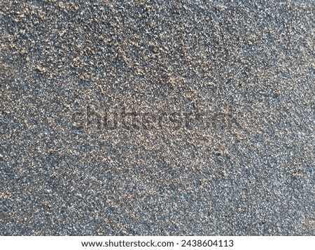 In the picture is a black sand background


