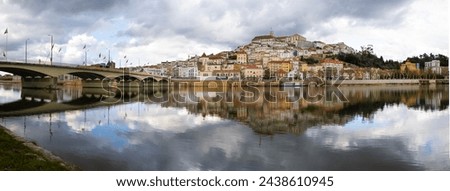 View of Coimbra and University of Coimbra from the left bank of the Mondego River  Royalty-Free Stock Photo #2438610945