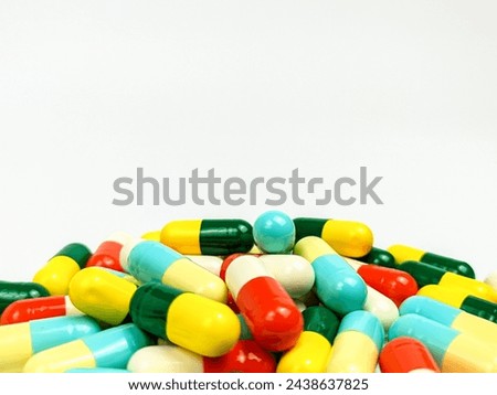 Colorful medicine capsules isolated on a white background