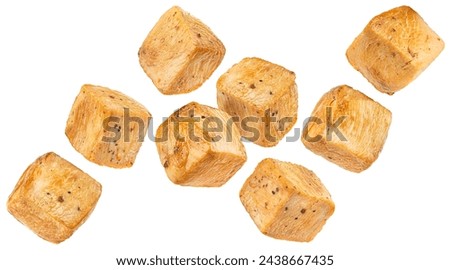 Roasted chicken cubes isolated on white background Royalty-Free Stock Photo #2438667435
