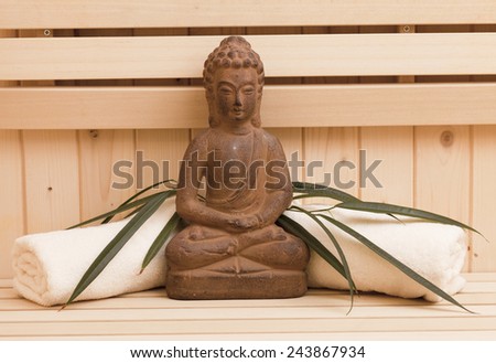 meditation and spa background in sauna with buddha statue