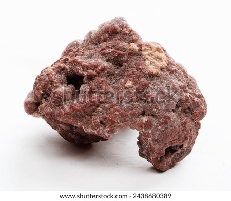 specimen of natural brown chalcedony mineral closeup on white background Royalty-Free Stock Photo #2438680389