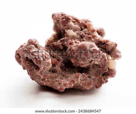 piece of natural brown chalcedony mineral closeup on white background Royalty-Free Stock Photo #2438684547