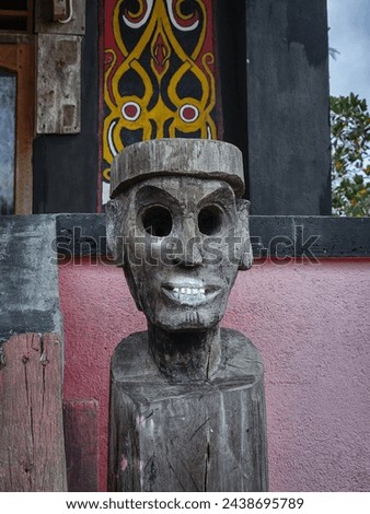 traditional wooden statue typical of the Dayak tribe.