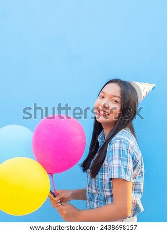 Smily girl hold balloon on party.