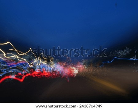 Abstract background of vehicle lights on a toll road in Bandung, Indonesia. Photo taken on February 14th, 2024.