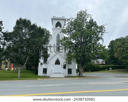 The front exterior of the Trinity United Church in Mahone Bay, NS. Royalty-Free Stock Photo #2438710581