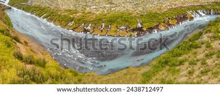 Aerial view of Beautiful blue river and rock formations at Barnafoss waterfalls in Western Iceland.