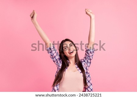 Close up photo yelling amazing beautiful her she lady amusement both arms hands raised up party festive celebrate holiday wear casual checkered plaid shirt clothes outfit isolated pink background