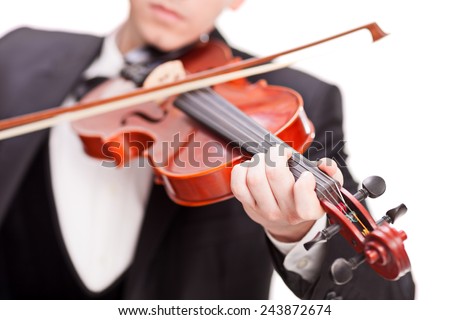Studio shot of a violinist playing a violin isolated on white background with the focus on his fingers