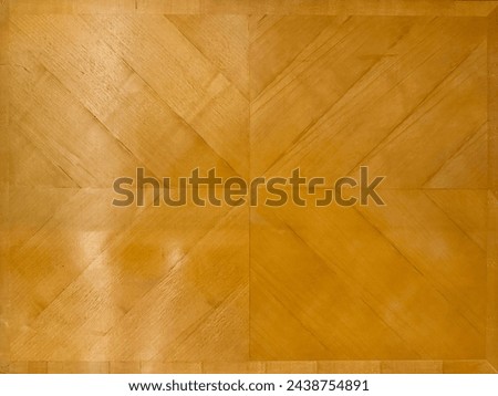 Solid natural brown or yellow teakwood in chevron pattern, mirrored and juxtaposed forming X pattern. Coated and Varnished semi glossy, seamless texture.