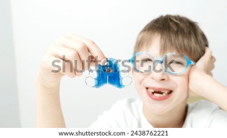 Boy with a plate to correct teeth bite